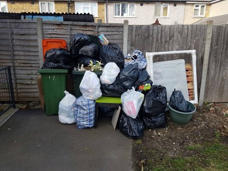 Residents disposing of old furniture at a Mitcham recycling center